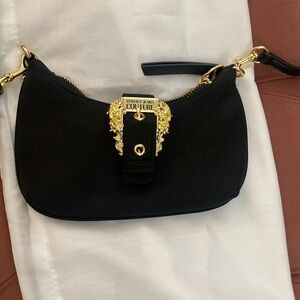 Like new versase jeans courtier bag